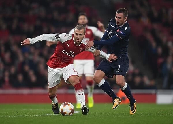 Arsenal's Jack Wilshere Clashes with Crvena Zvezda's Nenad Krsticic in Europa League Showdown