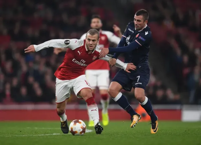 Framed Print : Arsenal's Jack Wilshere Clashes with Crvena Zvezda's Nenad Krsticic in Europa League Showdown Framed Print : Arsenal's Jack Wilshere Clashes with Crvena Zvezda's Nenad Krsticic in Europa League Showdown