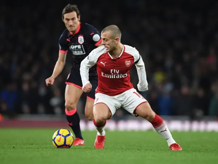 Framed Print : Arsenal's Jack Wilshere Clashes with Huddersfield's Dean Whitehead in Premier League Showdown Framed Print : Arsenal's Jack Wilshere Clashes with Huddersfield's Dean Whitehead in Premier League Showdown