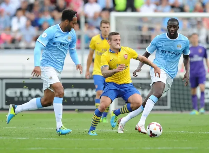 Framed Print : Arsenal's Jack Wilshere Clashes with Manchester City's Yaya Toure and Joleon Lescott during Pre-Season Friendly