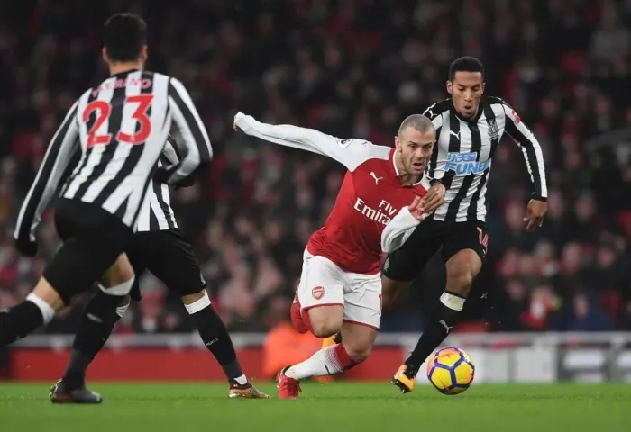 Framed Print : Arsenal's Jack Wilshere Clashes with Newcastle's Isaac Hayden in Premier League Showdown Framed Print : Arsenal's Jack Wilshere Clashes with Newcastle's Isaac Hayden in Premier League Showdown