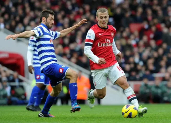 Framed Print : Arsenal's Jack Wilshere Clashes with QPR's Esteban Granero (2012-13) Framed Print : Arsenal's Jack Wilshere Clashes with QPR's Esteban Granero (2012-13)