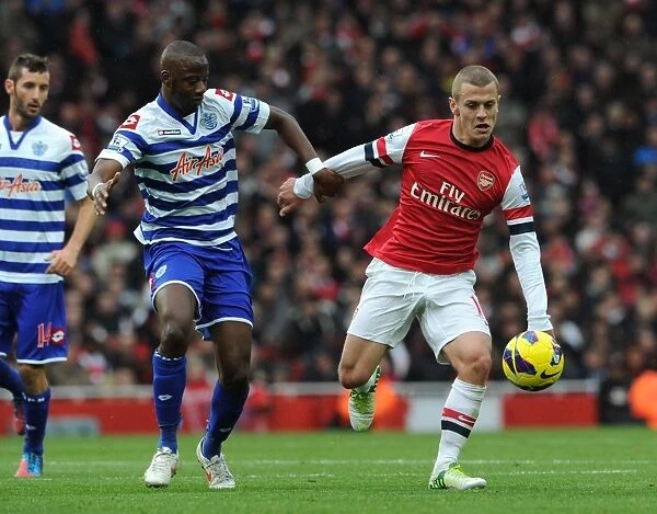 Arsenal's Jack Wilshere Clashes with QPR's Samba Diakite in Premier League Showdown