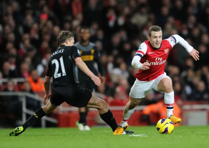 Framed Print : Arsenal's Jack Wilshere Evades Liverpool's Lucas Leiva During Intense Premier League Clash