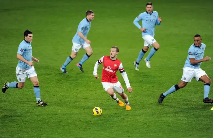 Framed Print : Arsenal's Jack Wilshere Faces Manchester City's Midfield Trio: Gareth Barry, James Milner, Javi Garcia