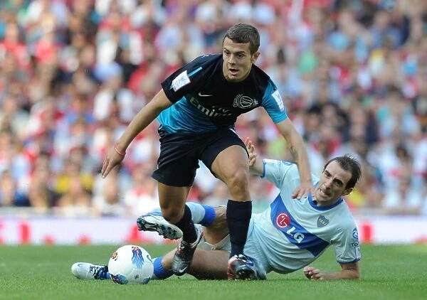 Arsenal's Jack Wilshere Faces Off Against Boca Juniors Leandro Somoza during the 2011-12 Emirates Cup