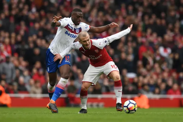 Framed Print : Arsenal's Jack Wilshere Faces Off Against Bruno Martins Indi in Intense Arsenal v Stoke City Clash Framed Print : Arsenal's Jack Wilshere Faces Off Against Bruno Martins Indi in Intense Arsenal v Stoke City Clash