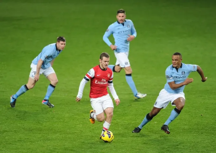 Framed Print : Arsenal's Jack Wilshere Faces Off Against Manchester City's Milner, Garcia, and Kompany Framed Print : Arsenal's Jack Wilshere Faces Off Against Manchester City's Milner, Garcia, and Kompany
