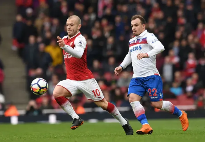 Framed Print : Arsenal's Jack Wilshere Faces Off Against Stoke's Xherdan Shaqiri in Intense Premier League Clash