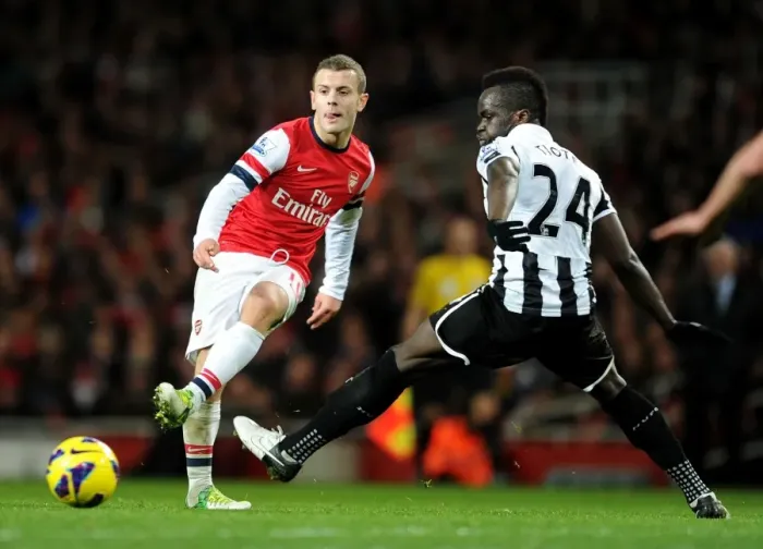 Framed Print : Arsenal's Jack Wilshere Fends Off Newcastle's Cheick Tiote: A Battle in the Midfield, December 2012