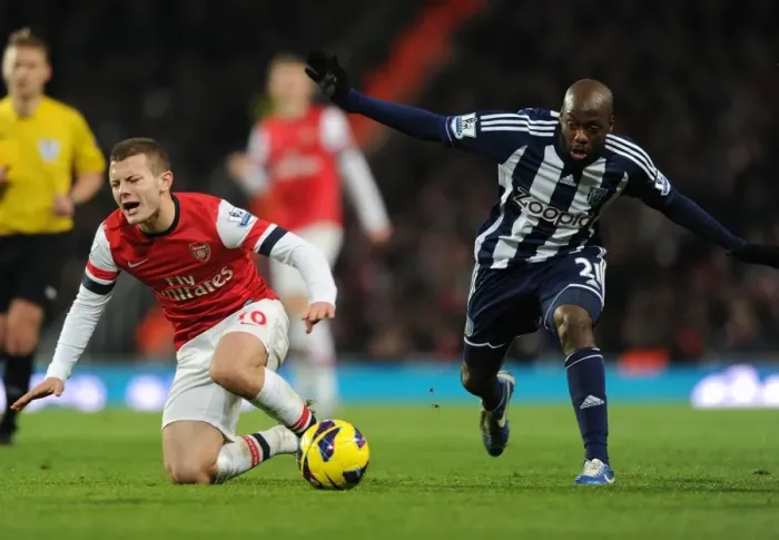 Framed Print : Arsenal's Jack Wilshere Fouls Youssouf Mulumbu in Premier League Clash (2012-13)