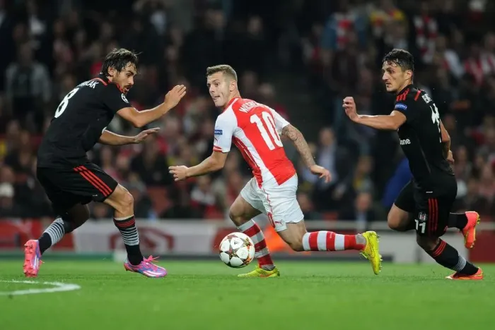 Framed Print : Arsenal's Jack Wilshere Goes Head-to-Head with Mustafa Pektemek and Ersan Gulum in Intense UEFA Champions League Showdown Framed Print : Arsenal's Jack Wilshere Goes Head-to-Head with Mustafa Pektemek and Ersan Gulum in Intense UEFA Champions League Showdown