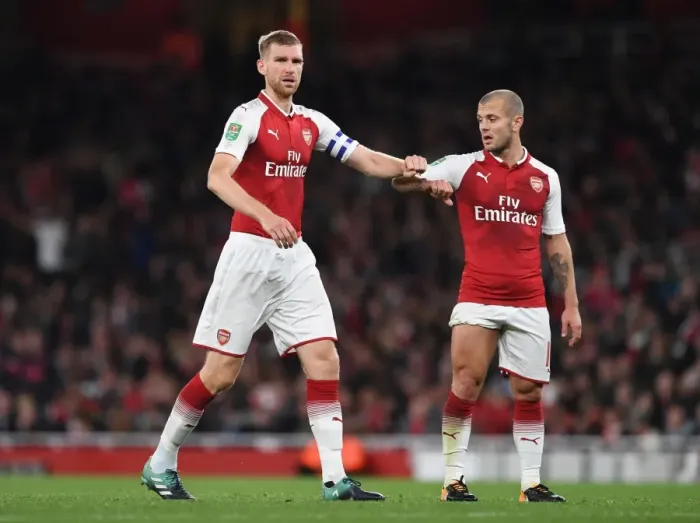 Framed Print : Arsenal's Jack Wilshere and Per Mertesacker in Action against Doncaster Rovers in Carabao Cup