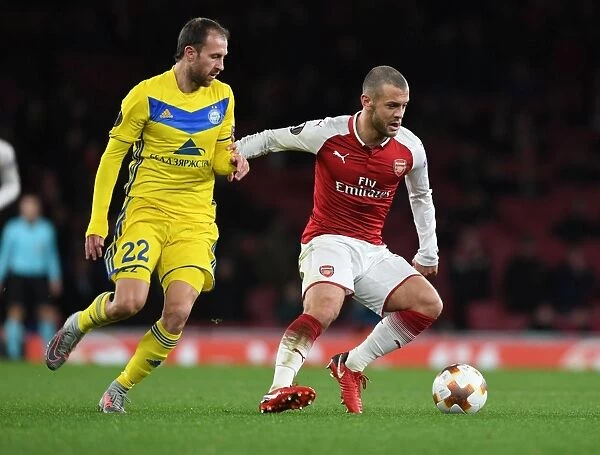 Arsenal's Jack Wilshere Outmaneuvers BATE's Igor Stasevich in Europa League Clash