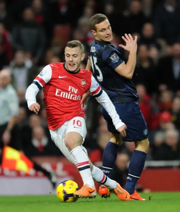 Framed Print : Arsenal's Jack Wilshere Outmaneuvers Manchester United's Nemanja Vidic