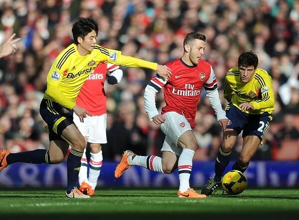Arsenal's Jack Wilshere Outmaneuvers Sunderland's Ki and Vergini in 2013-14 Premier League Clash