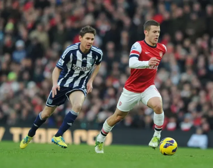 Framed Print : Arsenal's Jack Wilshere Outmaneuvers West Brom's Zoltan Gera during the 2012-13 Premier League Match Framed Print : Arsenal's Jack Wilshere Outmaneuvers West Brom's Zoltan Gera during the 2012-13 Premier League Match