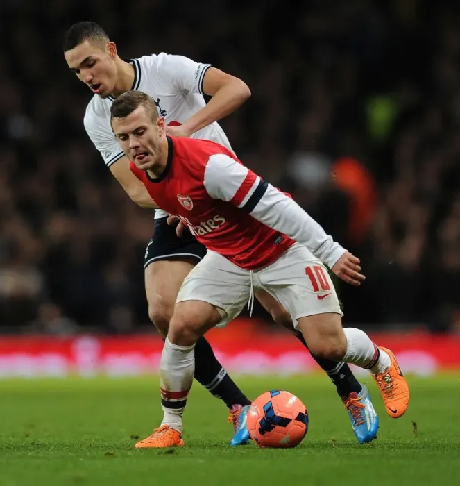 Framed Print : Arsenal's Jack Wilshere Overpowers Tottenham's Bentaleb in FA Cup Battle Framed Print : Arsenal's Jack Wilshere Overpowers Tottenham's Bentaleb in FA Cup Battle