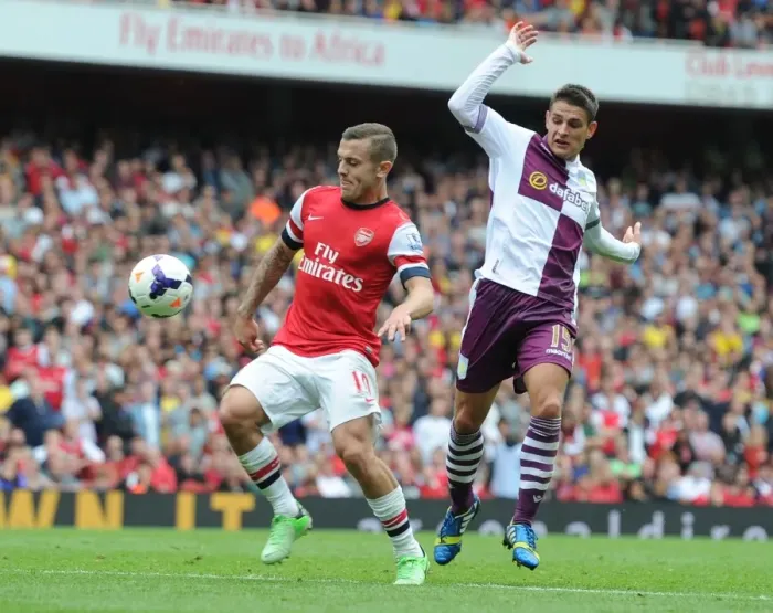 Framed Print : Arsenal's Jack Wilshere Surges Past Aston Villa's Ashley Westwood in 2013-14 Premier League Clash Framed Print : Arsenal's Jack Wilshere Surges Past Aston Villa's Ashley Westwood in 2013-14 Premier League Clash