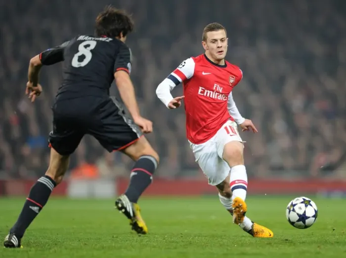 Framed Print : Arsenal's Jack Wilshere vs Bayern Munchen's Javi Martinez: A Battle of Midfield Maestros in the Champions League