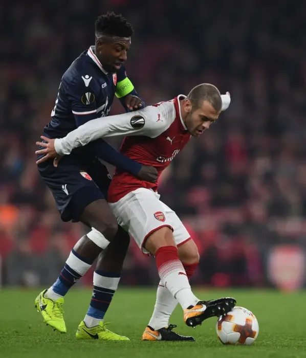 Framed Print : Arsenal's Jack Wilshere vs. Mitchell Donald: A Battle in the Arsenal FC vs. Crvena Zvezda UEFA Europa League Clash