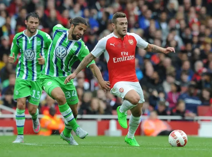 Framed Print : Arsenal's Jack Wilshere vs. Ricardo Rodriguez: A Battle at the Emirates Cup