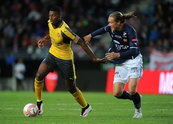 Arsenal's Jeff Reine-Adelaide Faces Off Against Viking FK's Andreas Breimy in Intense Pre-Season Clash