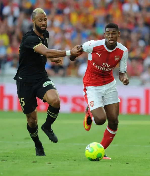 Framed Print : Arsenal's Jeff Reine-Adelaide vs. John Bostock in Intense Lens Friendly Clash, 2016