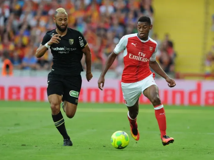 Framed Print : Arsenal's Jeff Reine-Adelaide vs John Bostock: Intense Face-Off in Lens Friendly, 2016