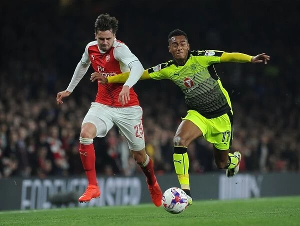 Arsenal's Jenkinson Clashes with Reading's Wieser in EFL Cup Battle