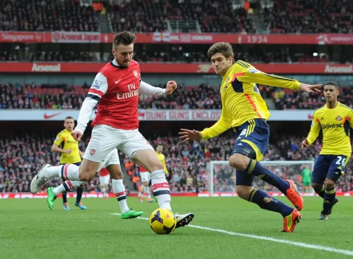 Framed Print : Arsenal's Jenkinson Faces Off Against Alonso in Intense Premier League Clash