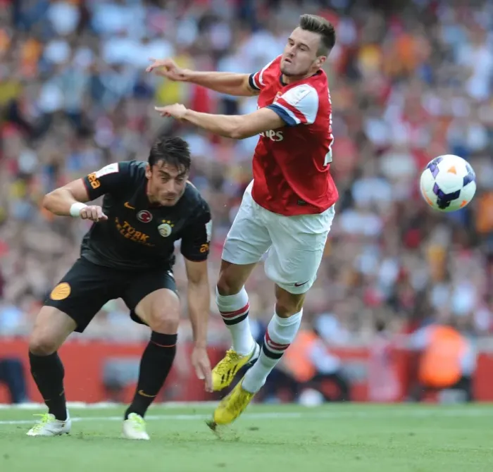 Framed Print : Arsenal's Jenkinson Faces Off Against Riera as Galatasaray Takes Emirates Cup Lead
