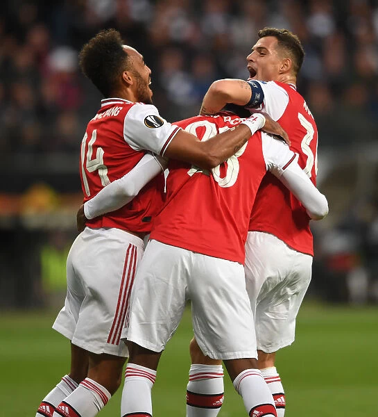 Arsenal's Joe Willock, Aubameyang, and Xhaka Celebrate Goal in Eintracht Frankfurt Clash (UEFA Europa League 2019-20)