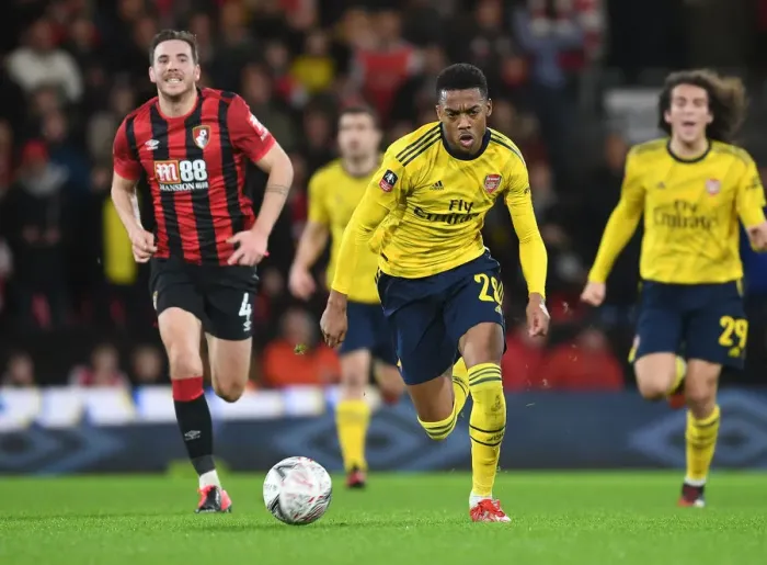 Framed Print : Arsenal's Joe Willock Breaks Past Bournemouth's Dan Gosling in FA Cup Fourth Round Clash Framed Print : Arsenal's Joe Willock Breaks Past Bournemouth's Dan Gosling in FA Cup Fourth Round Clash
