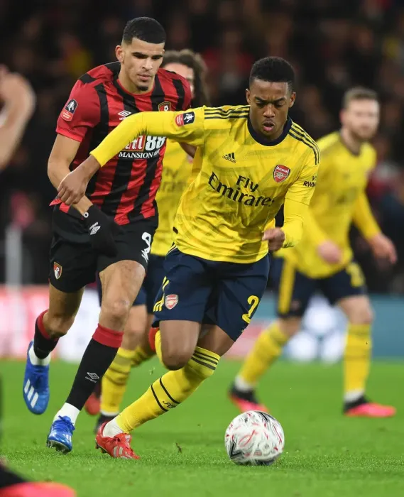 Framed Print : Arsenal's Joe Willock Clashes with Bournemouth's Dominic Solanke in FA Cup Fourth Round
