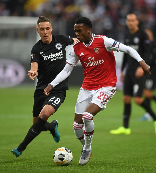 Arsenal's Joe Willock Clashes with Eintracht Frankfurt's Dominik Kohr in Europa League Showdown