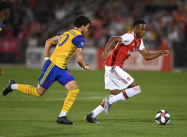 Arsenal's Joe Willock Faces Off Against Colorado Rapids Jordan Schweitzer in 2019-20 Pre-Season Clash