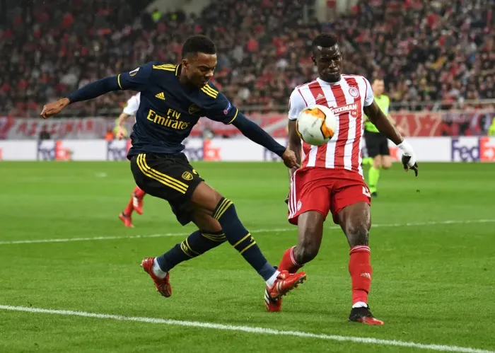 Framed Print : Arsenal's Joe Willock Faces Off Against Olympiacos Ousseynou Ba in Europa League Clash Framed Print : Arsenal's Joe Willock Faces Off Against Olympiacos Ousseynou Ba in Europa League Clash