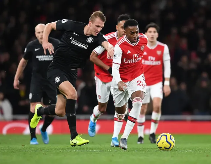 Framed Print : Arsenal's Joe Willock Outwits Dan Burn: A Premier League Tactical Battle at Emirates Stadium