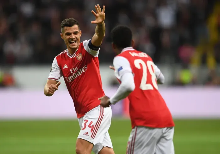 Framed Print : Arsenal's Joe Willock Scores in Europa League Victory over Eintracht Frankfurt: Granit Xhaka Celebrates Framed Print : Arsenal's Joe Willock Scores in Europa League Victory over Eintracht Frankfurt: Granit Xhaka Celebrates