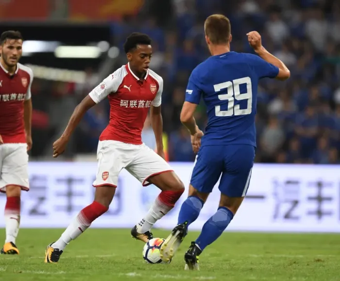 Framed Print : Arsenal's Joe Willock vs. Chelsea's Mario Pasalic: A Clash of Young Talents in Arsenal vs. Chelsea Pre-Season 2017-18, Beijing