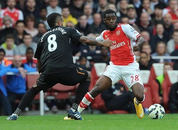 Arsenal's Joel Campbell Clashes with Hull's Tom Huddlestone in Premier League Showdown