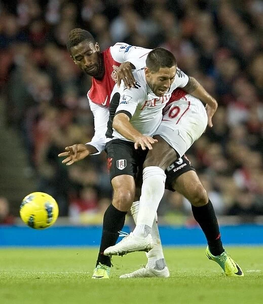 Arsenal's Johan Djourou Faces Off Against Fulham's Clint Dempsey in Premier League Clash