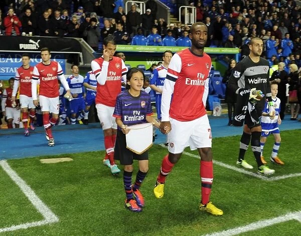 Arsenal's Johan Djourou and Mascot Before Capital One Cup Match vs. Reading