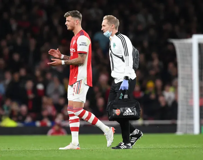 Framed Print : Arsenal's Jordan Reece Attends to Ben White's Injury During Arsenal vs Leeds United (Carabao Cup 2021-22) Framed Print : Arsenal's Jordan Reece Attends to Ben White's Injury During Arsenal vs Leeds United (Carabao Cup 2021-22)