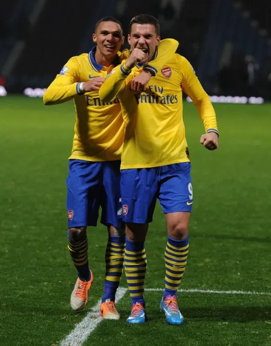 Framed Print : Arsenal's Jubilant Duo: Podolski and Gibbs Celebrate Victory over West Ham United