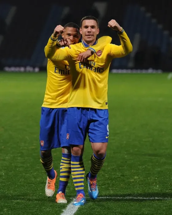 Framed Print : Arsenal's Jubilant Podolski and Gibbs: Celebrating a Goal at West Ham United (2013-14) Framed Print : Arsenal's Jubilant Podolski and Gibbs: Celebrating a Goal at West Ham United (2013-14)