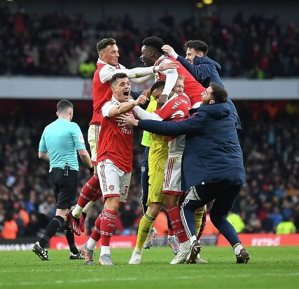 Arsenal's Jubilant Team: Celebrating the Third Goal Against AFC Bournemouth in the 2022-23 Premier League