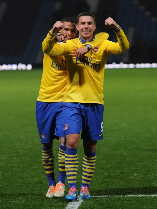 Framed Print : Arsenal's Jubilant Winning Moment: Podolski and Gibbs Celebrate against West Ham United