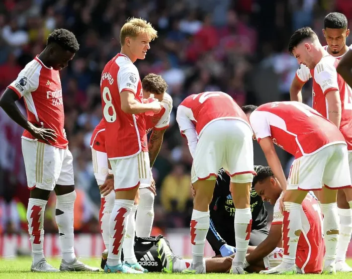 Framed Print : Arsenal's Jurrien Timber Receives Medical Attention During Arsenal vs Nottingham Forest (2023-24) Framed Print : Arsenal's Jurrien Timber Receives Medical Attention During Arsenal vs Nottingham Forest (2023-24)